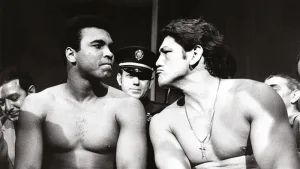 Sport/Boxing, New York, USA, 2nd December 1971, Heavyweight Boxers Muhammad Ali (left) and Argentina's Oscar Bonavena are pictured at the pre-fight medical before their December 7th fight, The picture shows Muhammad Ali seemingly unimpressed by the facial expressions of opponent Oscar Bonavena, Ali won the fight at the Felt Forum, New York on a 15th round Technical knock-out (Photo by Popperfoto/Getty Images)